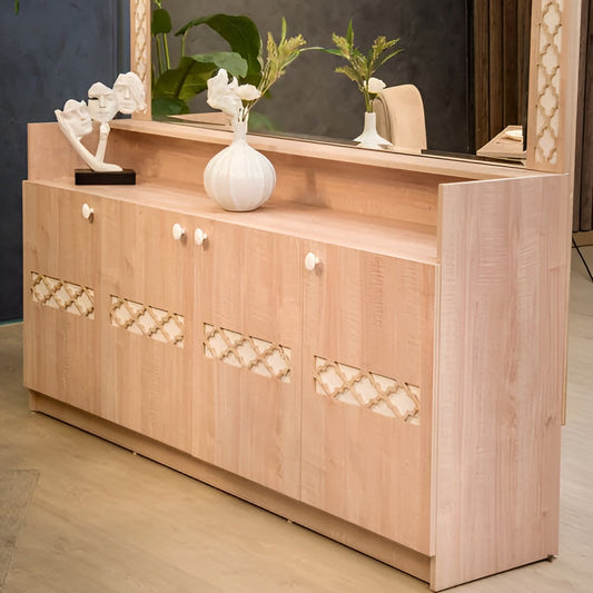 Wooden sideboard with decorative mirror and decor items in a room setting.