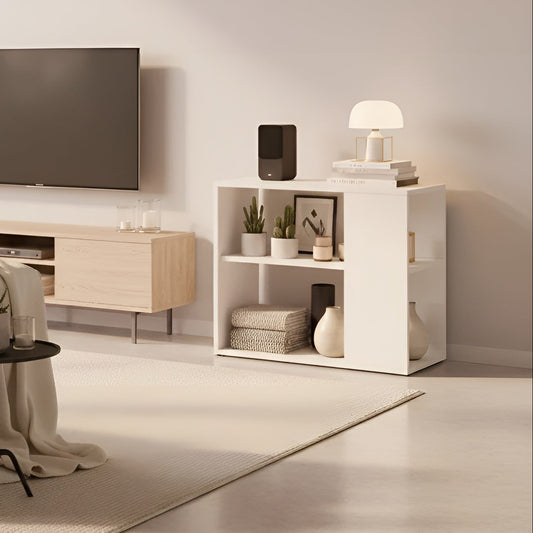 Modern living room with a TV, sofa, and decorative items.