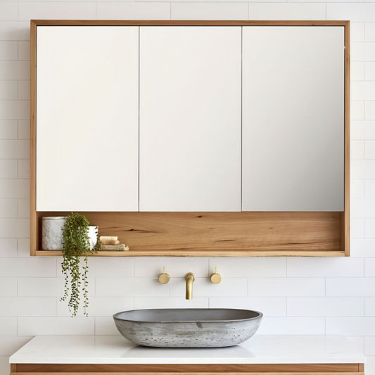 Bathroom with wooden vanity, mirror, and concrete sink.