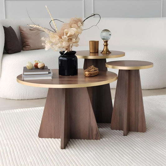 Modern side tables with wooden and gold accents in a living room setting.
