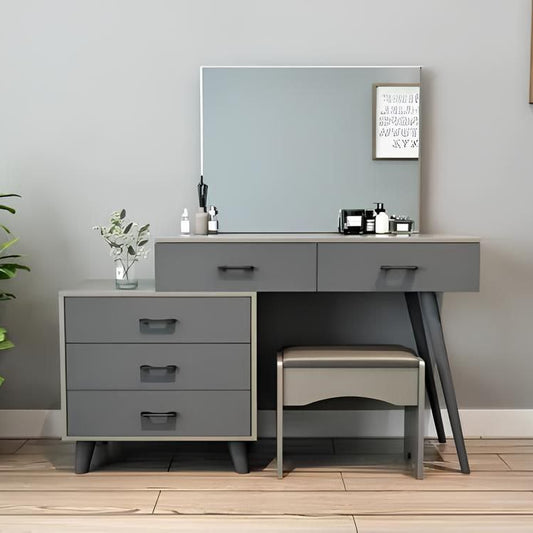 Gray vanity with mirror, drawers, and stool in a room setting.