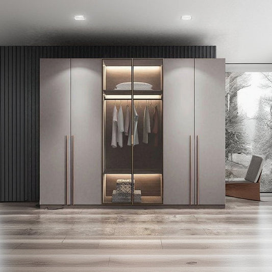 Modern wardrobe with glass door displaying clothes and interior lighting